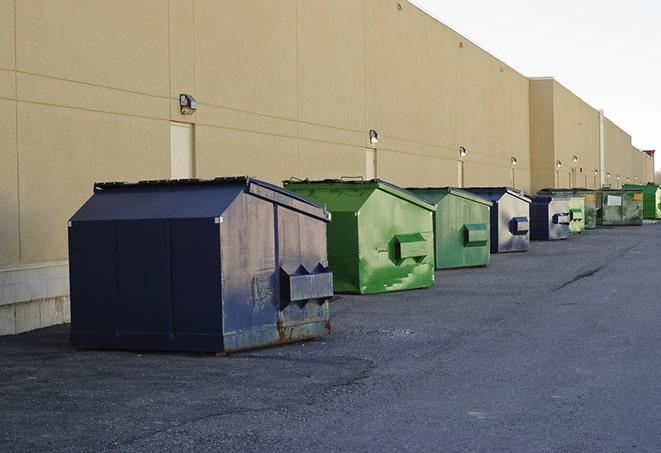 a row of construction dumpsters parked on a jobsite in Haymarket